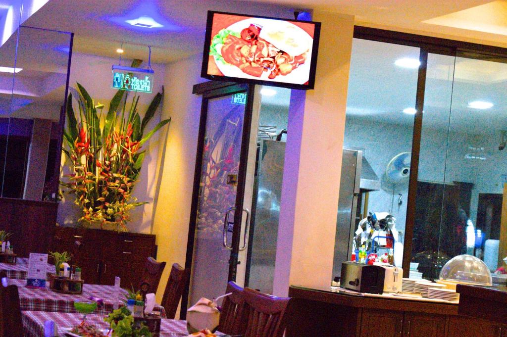 TV a/nebo společenská místnost v ubytování Orchid Resortel