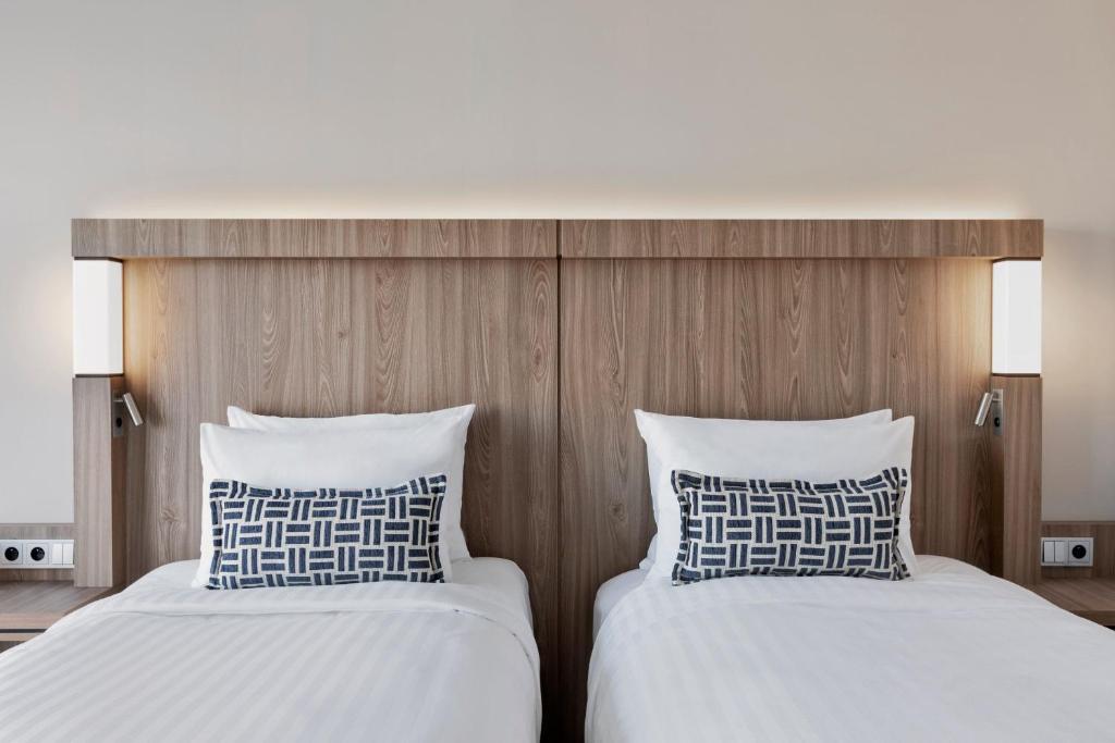 Postel nebo postele na pokoji v ubytování Courtyard by Marriott Szczecin City
