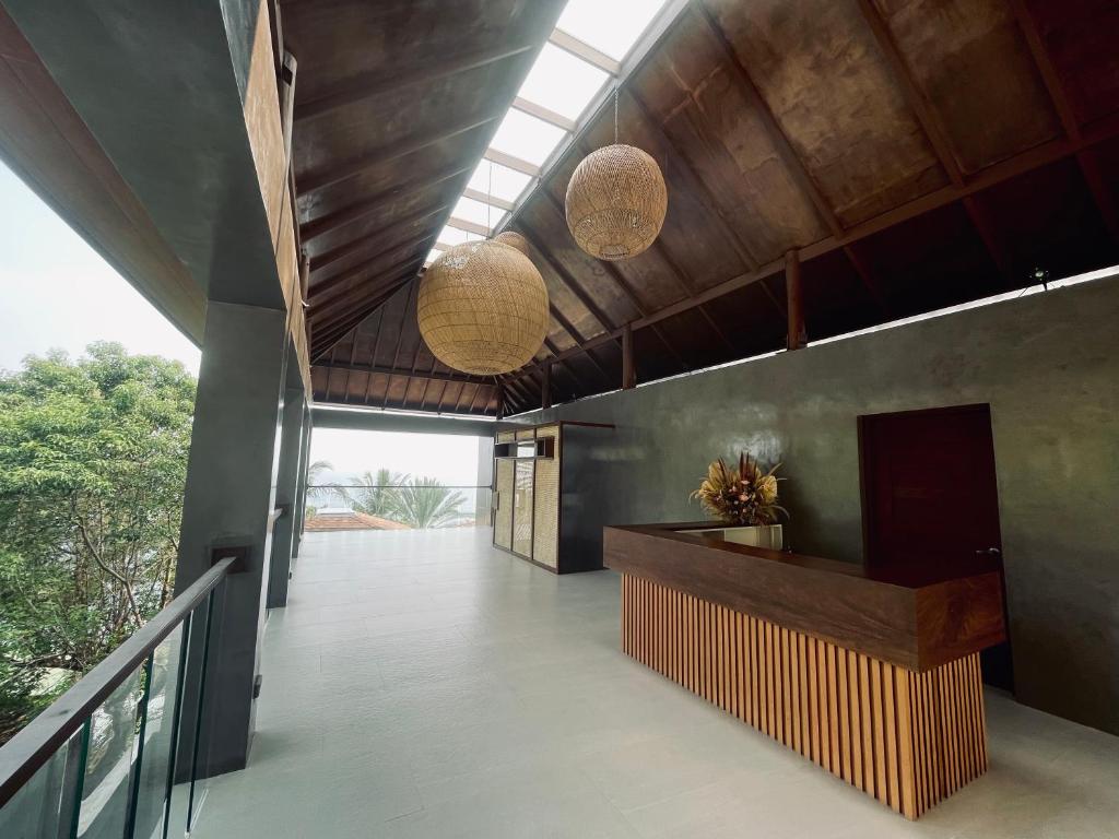 a hallway of a house with two lights on the ceiling at Casa Talia Beach House in Lobo