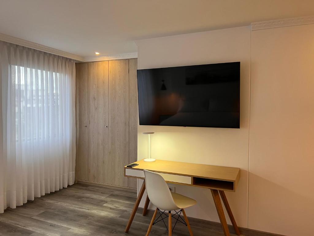 TV a/nebo společenská místnost v ubytování Suites 109 GH Usaquén