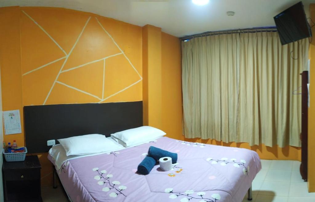 Postel nebo postele na pokoji v ubytování Hostal Bryana Inn Baños