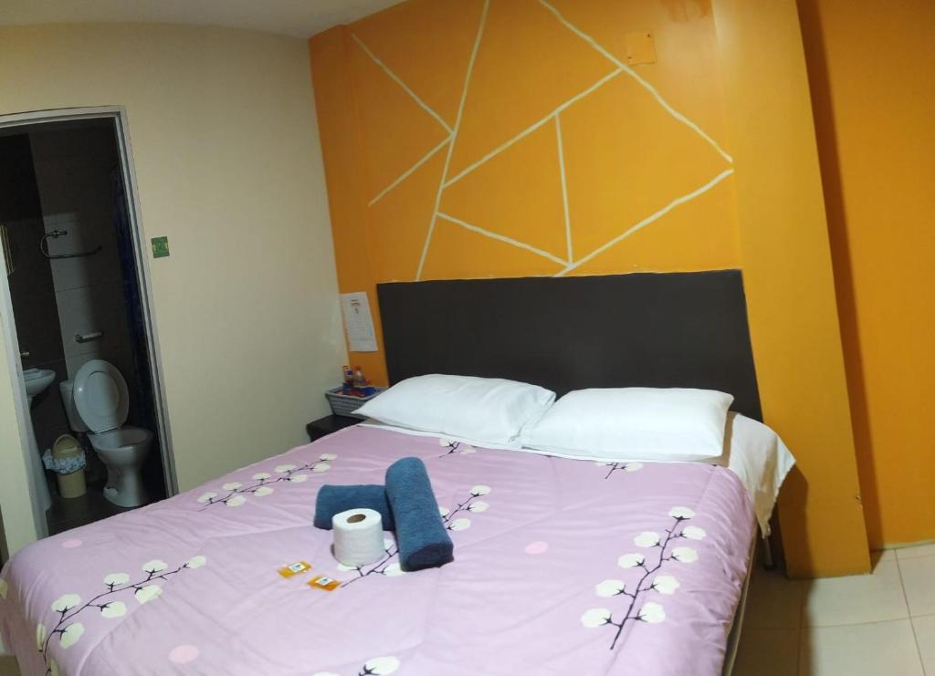 Postel nebo postele na pokoji v ubytování Hostal Bryana Inn Baños