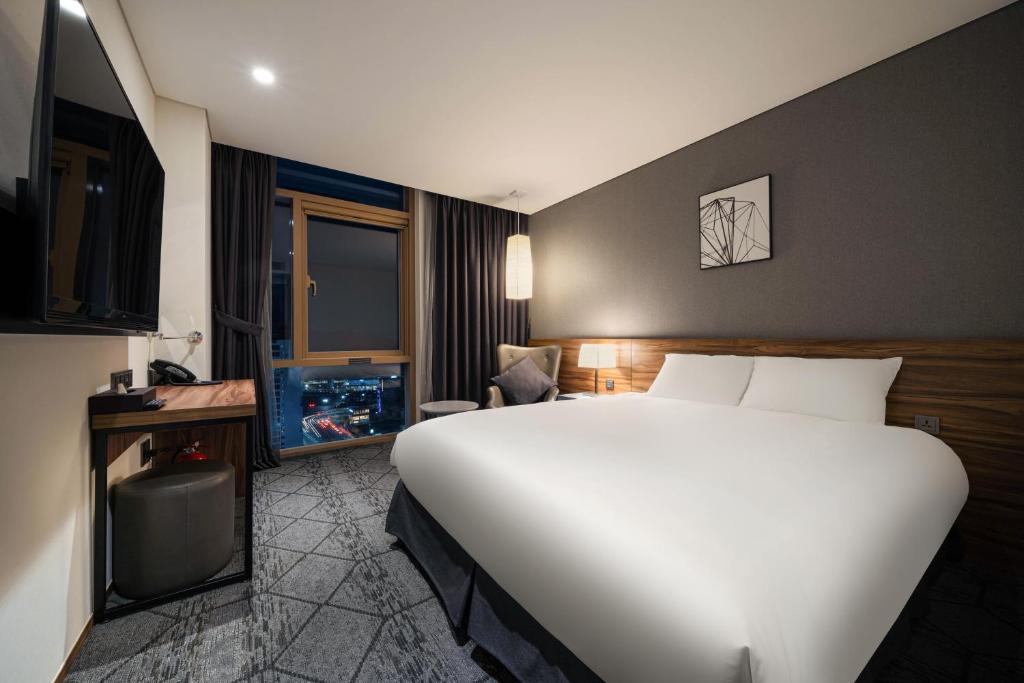 Postel nebo postele na pokoji v ubytování Staz Hotel Ulsan