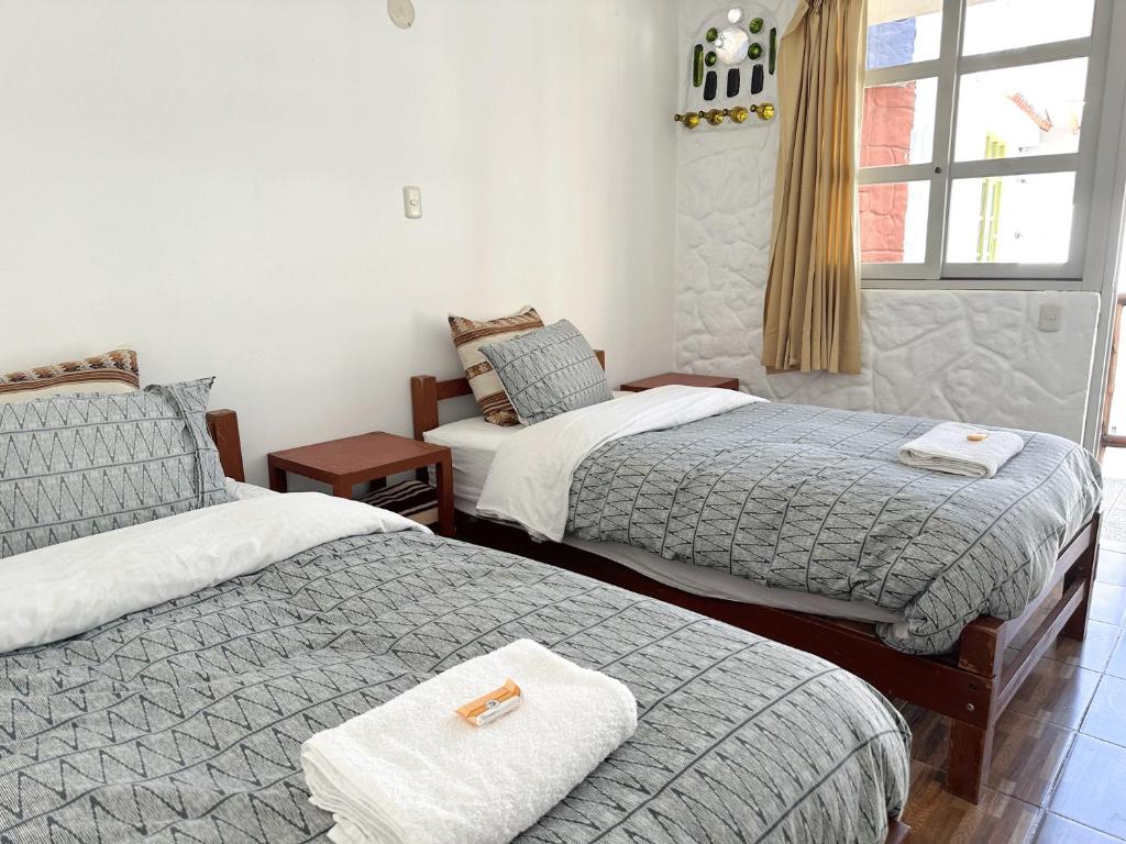 Postel nebo postele na pokoji v ubytování Homestay Pachamama