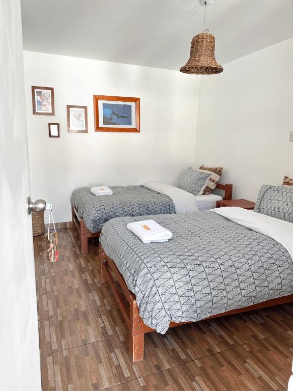 Postel nebo postele na pokoji v ubytování Homestay Pachamama