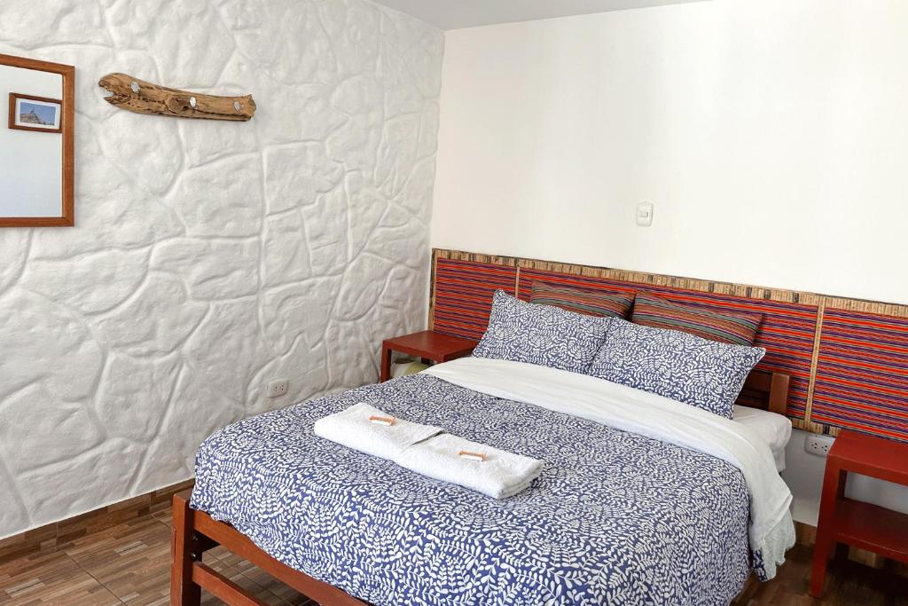 Postel nebo postele na pokoji v ubytování Homestay Pachamama