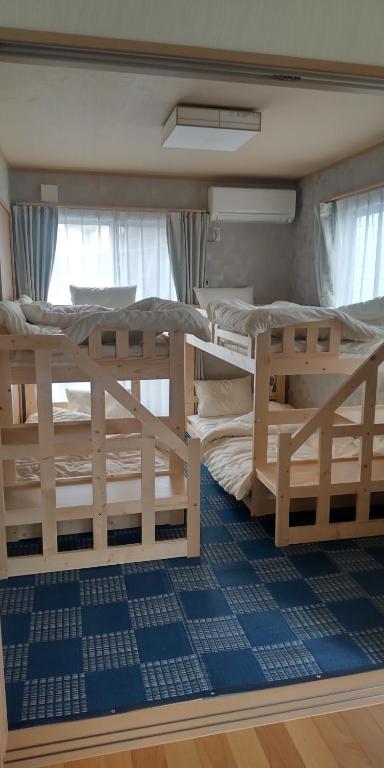 Postel nebo postele na pokoji v ubytování Guest Room安曇野2466
