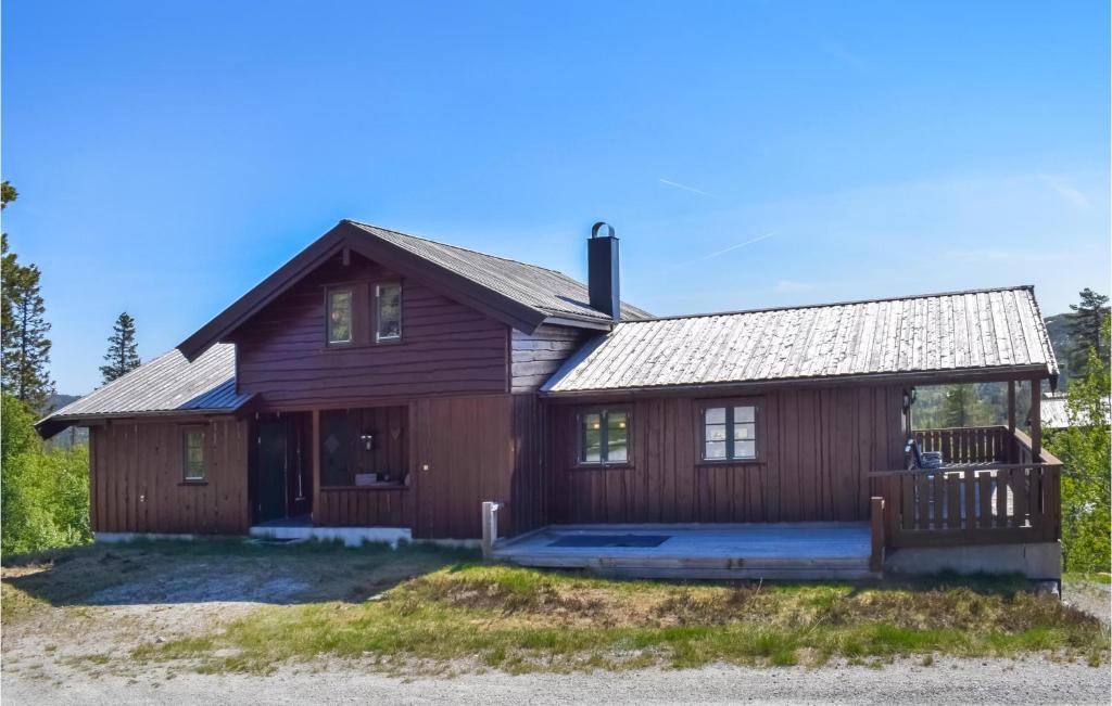 a large wooden house with a porch at 4 Bedroom Lovely Home In Dalen in Dalen