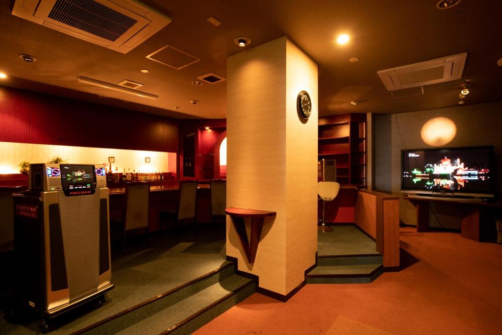 TV a/nebo společenská místnost v ubytování Hotel Shin Makomo