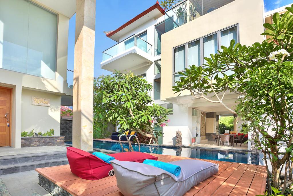 a pool in the backyard of a house at ECHO BEACH DESIGNER APARTMENT in Canggu