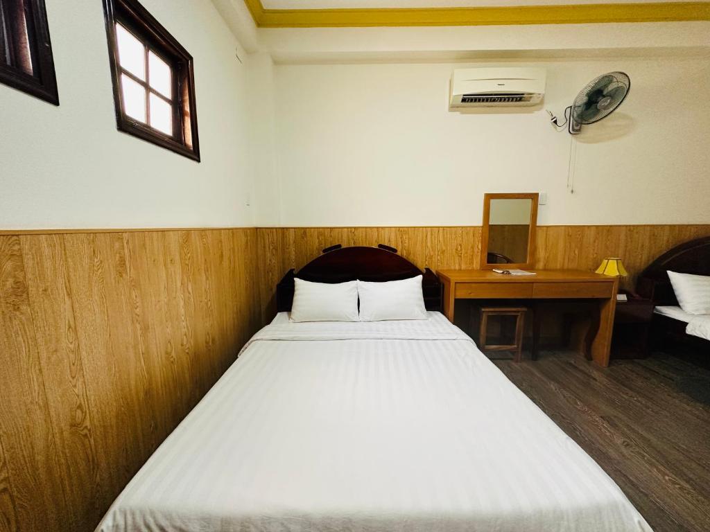 Postel nebo postele na pokoji v ubytování Khách sạn Mekong Star