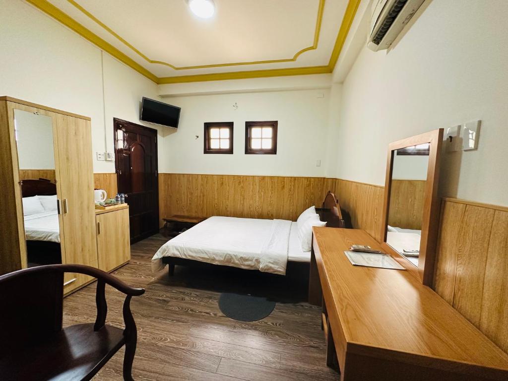 Postel nebo postele na pokoji v ubytování Khách sạn Mekong Star