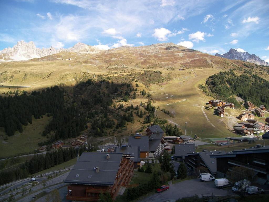 a view of a town in front of a mountain at Majestic Apartment in Meribel Mottaret close to Skiing in Méribel