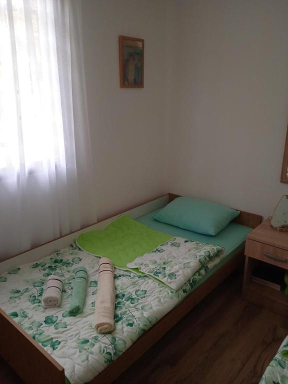 Postel nebo postele na pokoji v ubytování Oaza Kumbor