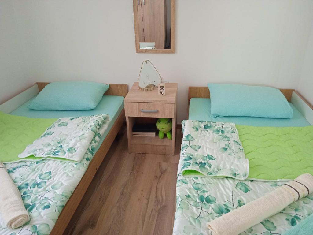 Postel nebo postele na pokoji v ubytování Oaza Kumbor