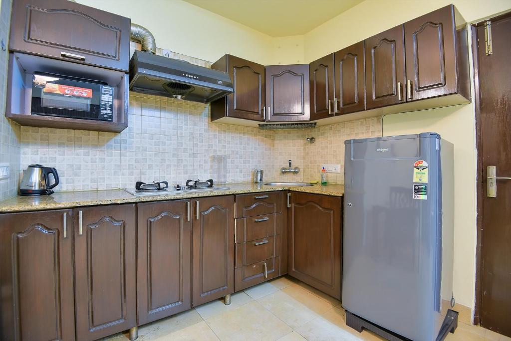Kuchyň nebo kuchyňský kout v ubytování Studio Serviced Apartments near Fortis Hospital