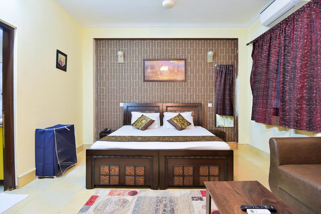 Postel nebo postele na pokoji v ubytování Studio Serviced Apartments near Fortis Hospital