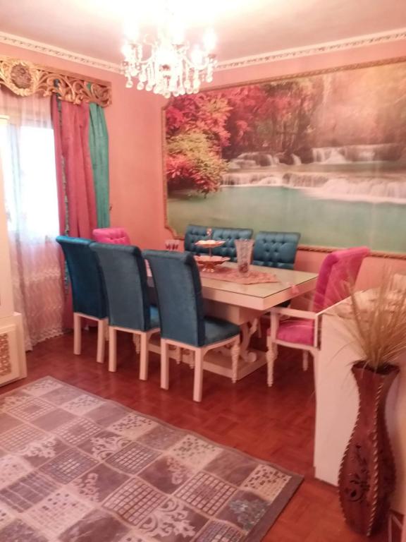 a dining room with a table and chairs at Apartment Close to the sea in Alexandria