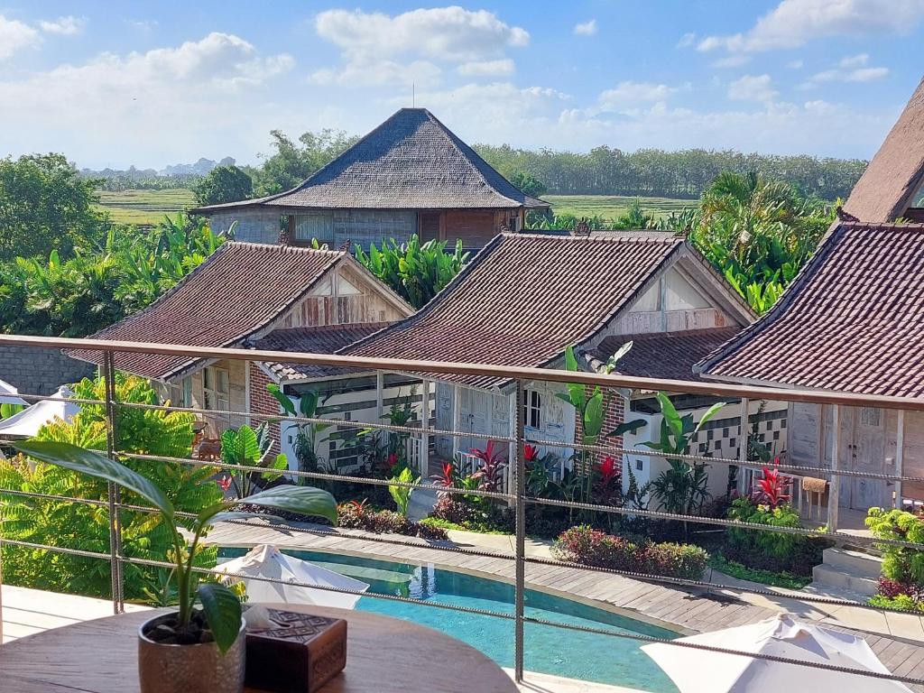 an aerial view of a resort with a swimming pool at Spaces Bali Unique Boutique Hotel in Munggu