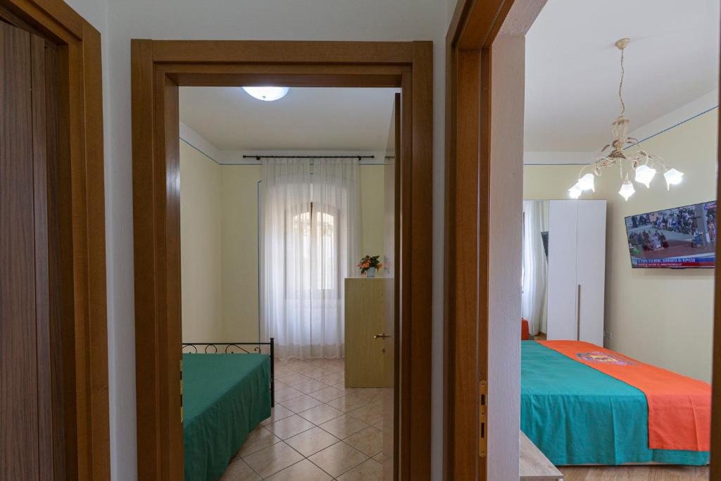 Postel nebo postele na pokoji v ubytování IBibiena - CASA CAMALDOLI