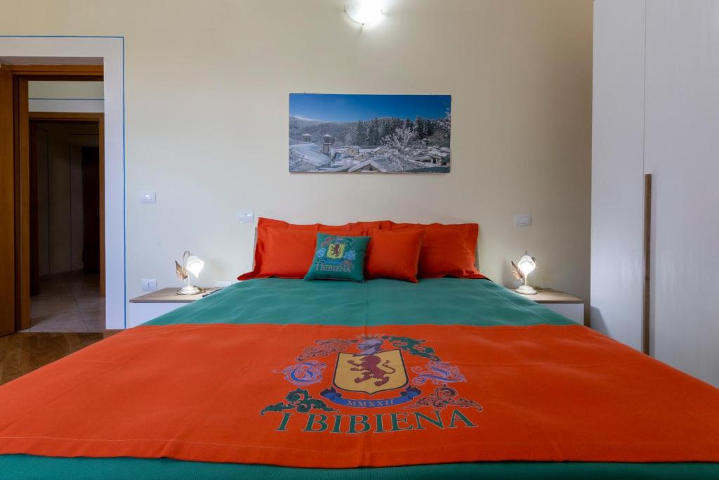 Postel nebo postele na pokoji v ubytování IBibiena - CASA CAMALDOLI