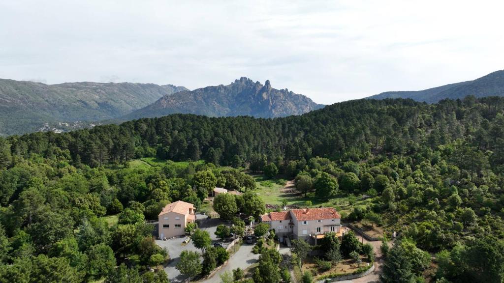 an aerial view of a house in the mountains at Les Hauts de Cavanello in Zonza