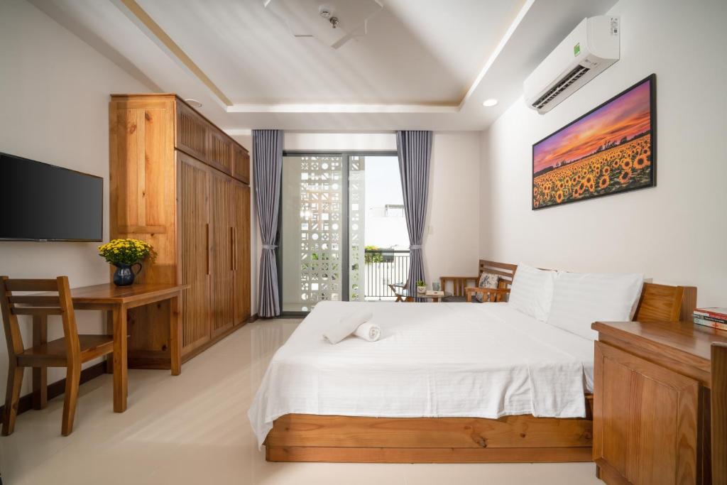 Ένα ή περισσότερα κρεβάτια σε δωμάτιο στο Carol Homestay & Apartment Đà Nẵng 4