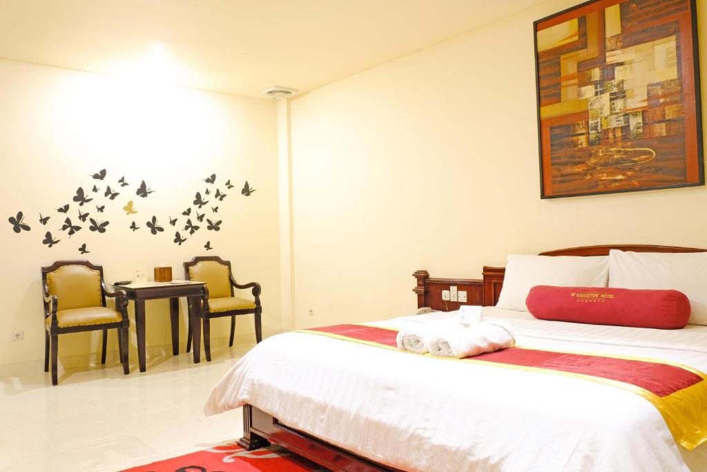 Postel nebo postele na pokoji v ubytování BI Executive Hotel