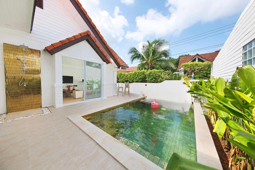 a swimming pool in the backyard of a house at Villa Lawana - Bophut - Stylish Private Luxury Villa in Bophut