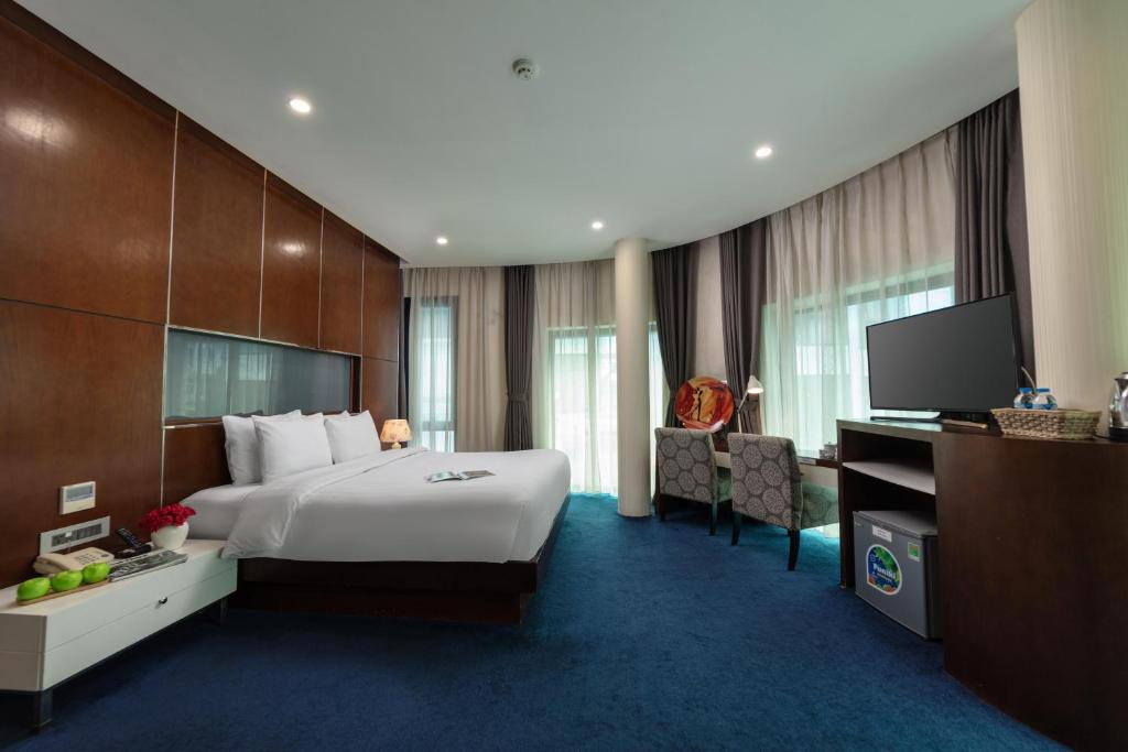 Postel nebo postele na pokoji v ubytování HALO HANOI HOTEL