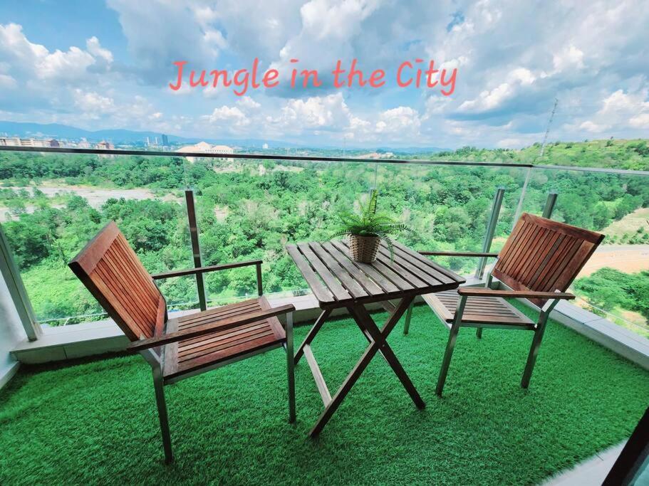 a table and two chairs on a balcony with a view at IOI CITY MALL #Conezion #luxury #Nexflix in Putrajaya