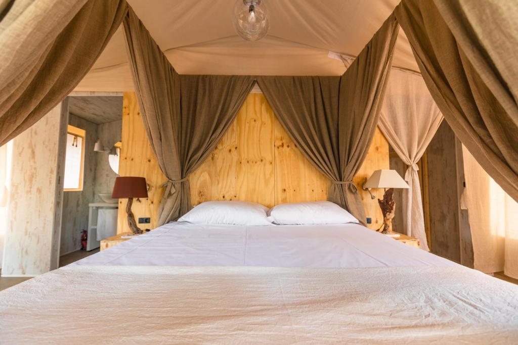 Voodi või voodid majutusasutuse Le Lenze Don Mimì Glamping toas