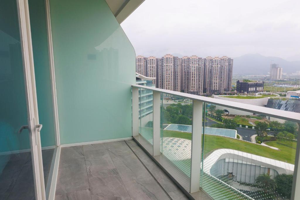 a balcony with a view of a city at Sheraton Zhaoqing Dinghu in Zhaoqing