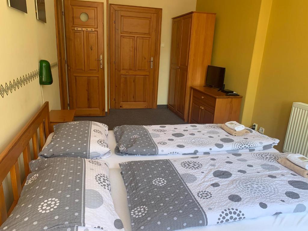 Postel nebo postele na pokoji v ubytování Hotel Pacifik