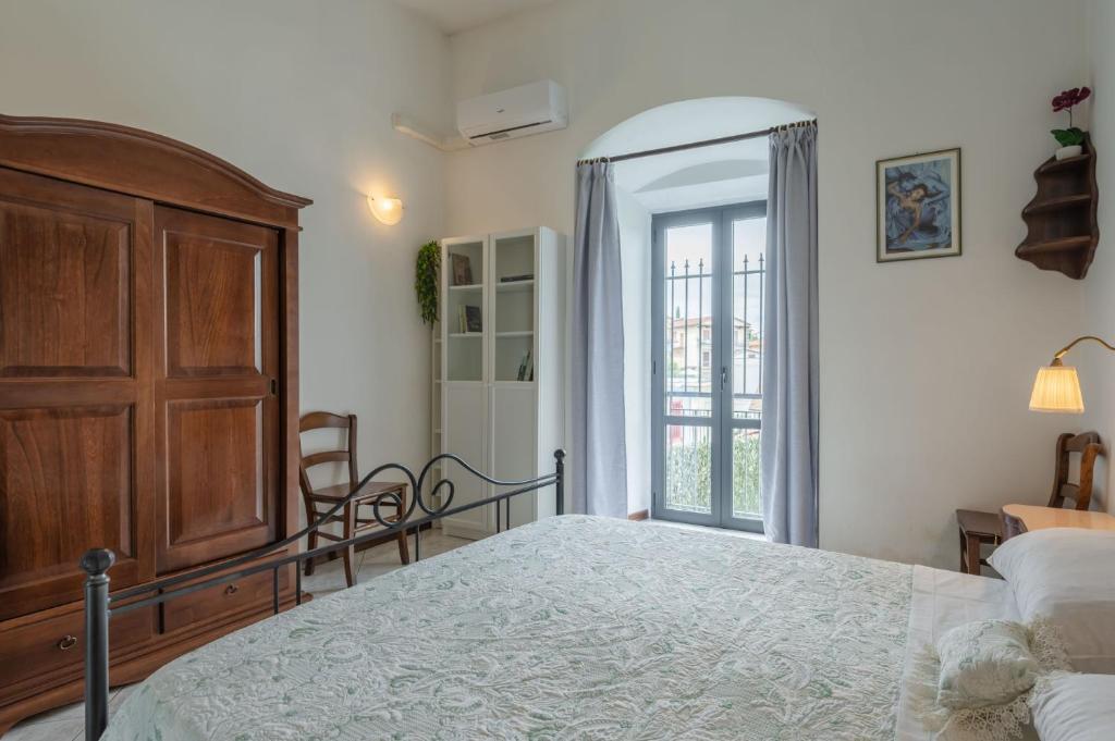 Postel nebo postele na pokoji v ubytování Casa dei Renai by Rentbeat