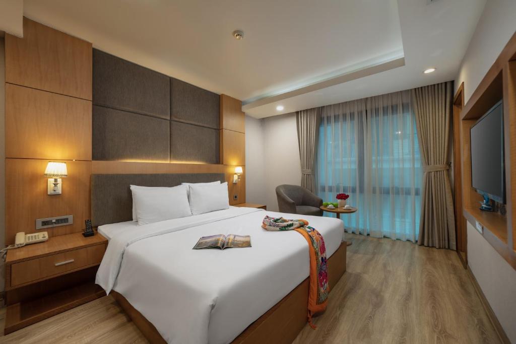 Postel nebo postele na pokoji v ubytování HALO HANOI HOTEL