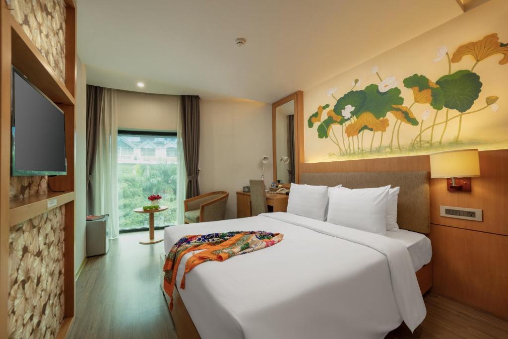 Postel nebo postele na pokoji v ubytování HALO HANOI HOTEL