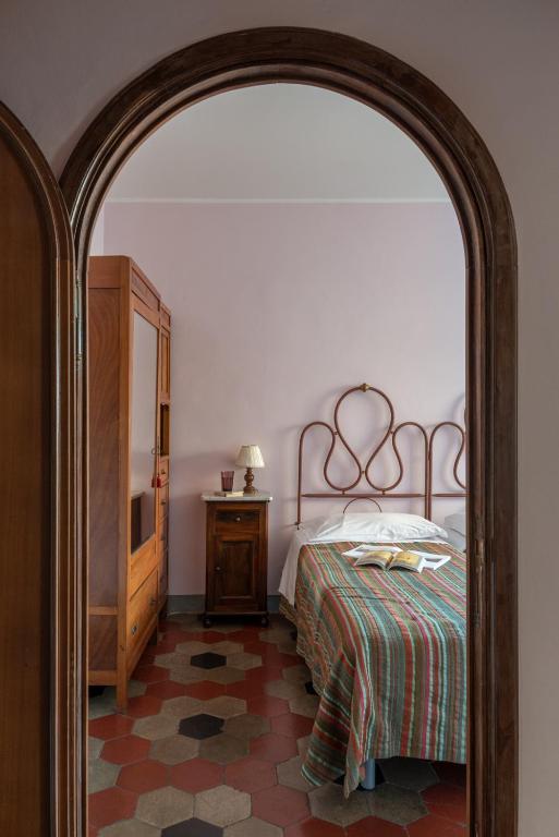Postel nebo postele na pokoji v ubytování Hotel Posta