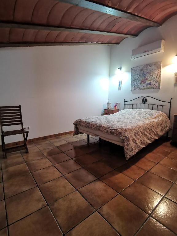 Łóżko lub łóżka w pokoju w obiekcie Casa Rural El Gandulillo