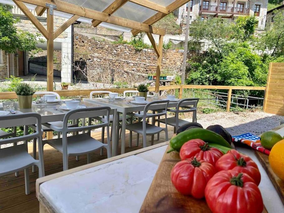 a table with tomatoes and other vegetables on a table at Casa Pirri in Espinama