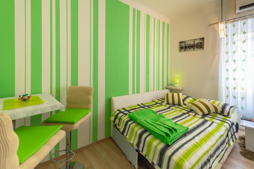 Posteľ alebo postele v izbe v ubytovaní Apartments Trend