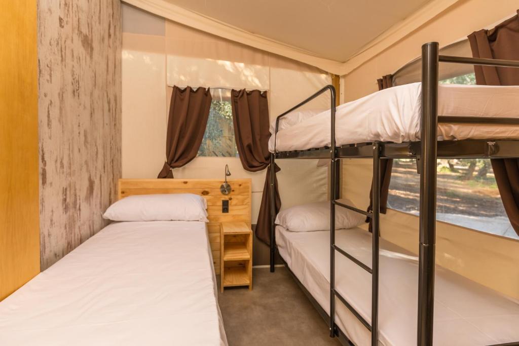 Voodi või voodid majutusasutuse Le Lenze Don Mimì Glamping toas