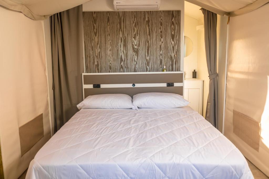 Voodi või voodid majutusasutuse Le Lenze Don Mimì Glamping toas