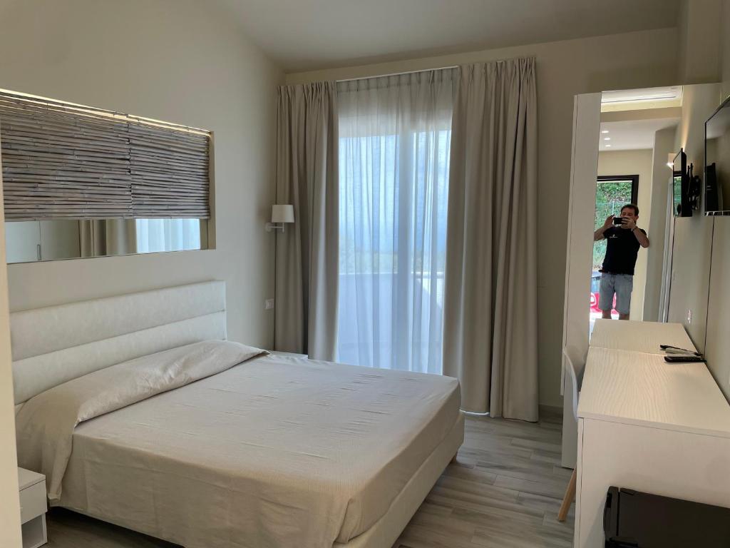 Postel nebo postele na pokoji v ubytování Borgo San Cosmo Tropea