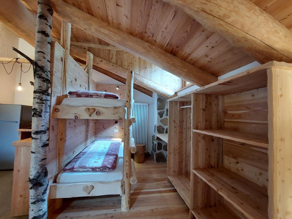Postel nebo postele na pokoji v ubytování Agriturismo Malga Pontevecchio