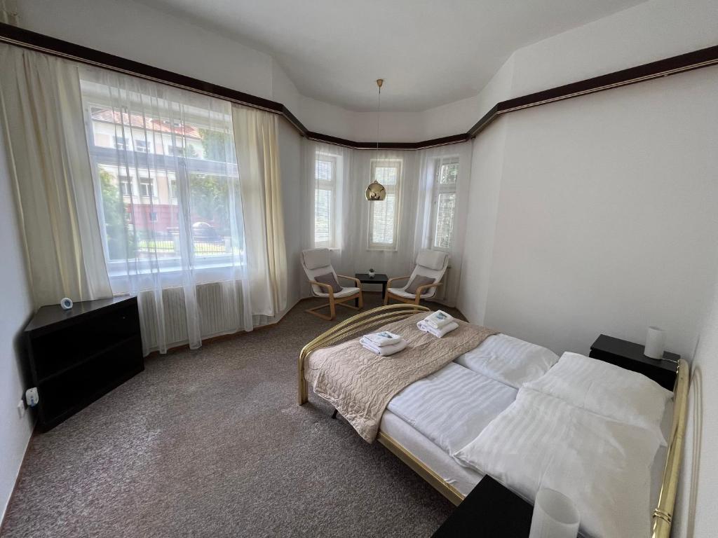 Postel nebo postele na pokoji v ubytování Hotel Lužná