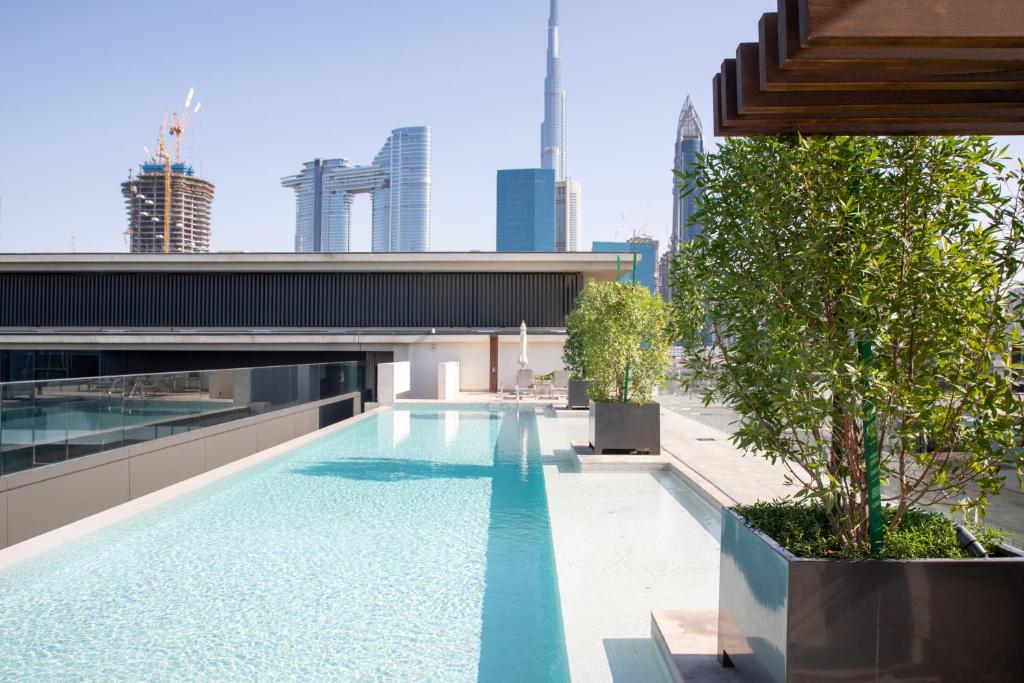a swimming pool on the roof of a building at Nasma Luxury Stays - City Walk Building 5 in Dubai