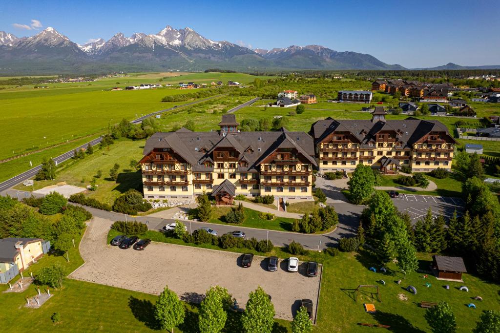 an aerial view of a resort with mountains in the background at Apartmany Sileas in Veľká Lomnica