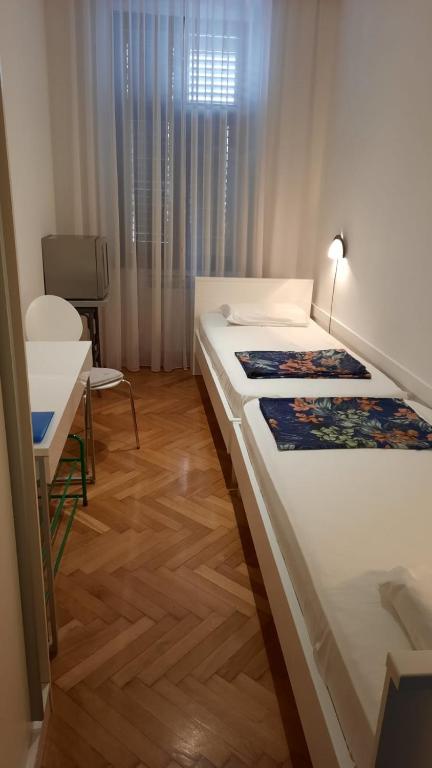 Postel nebo postele na pokoji v ubytování Rooms Aida