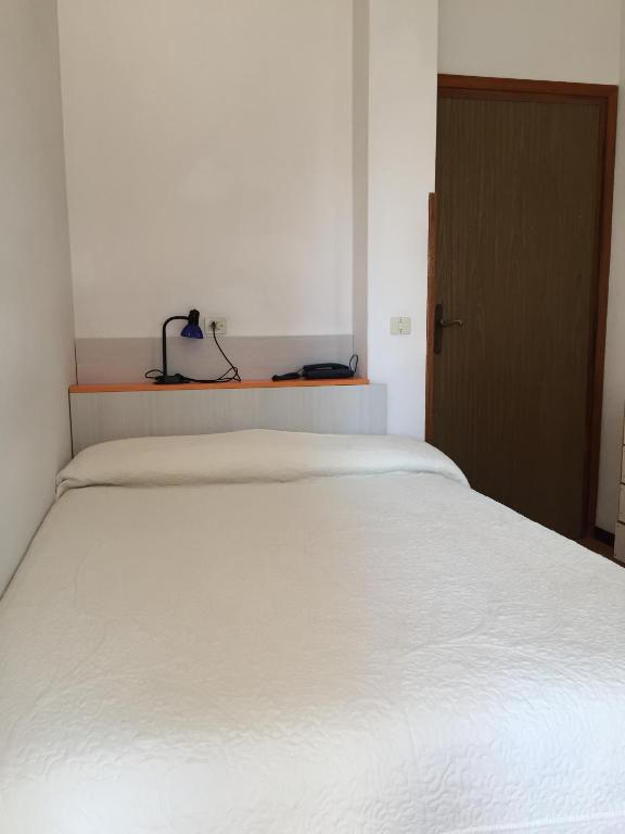 Postel nebo postele na pokoji v ubytování Hotel Halifax